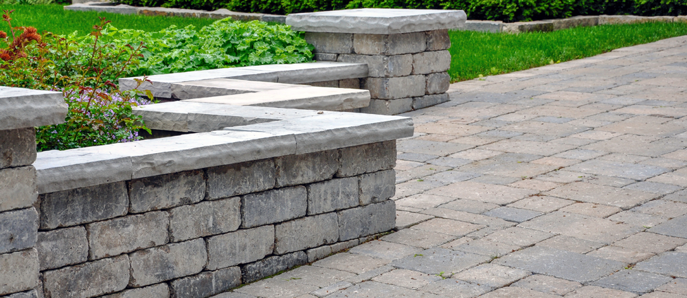 beautiful retaining wall with interlocking pathway